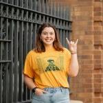  Kaylee Weigel standing at NDSU gates